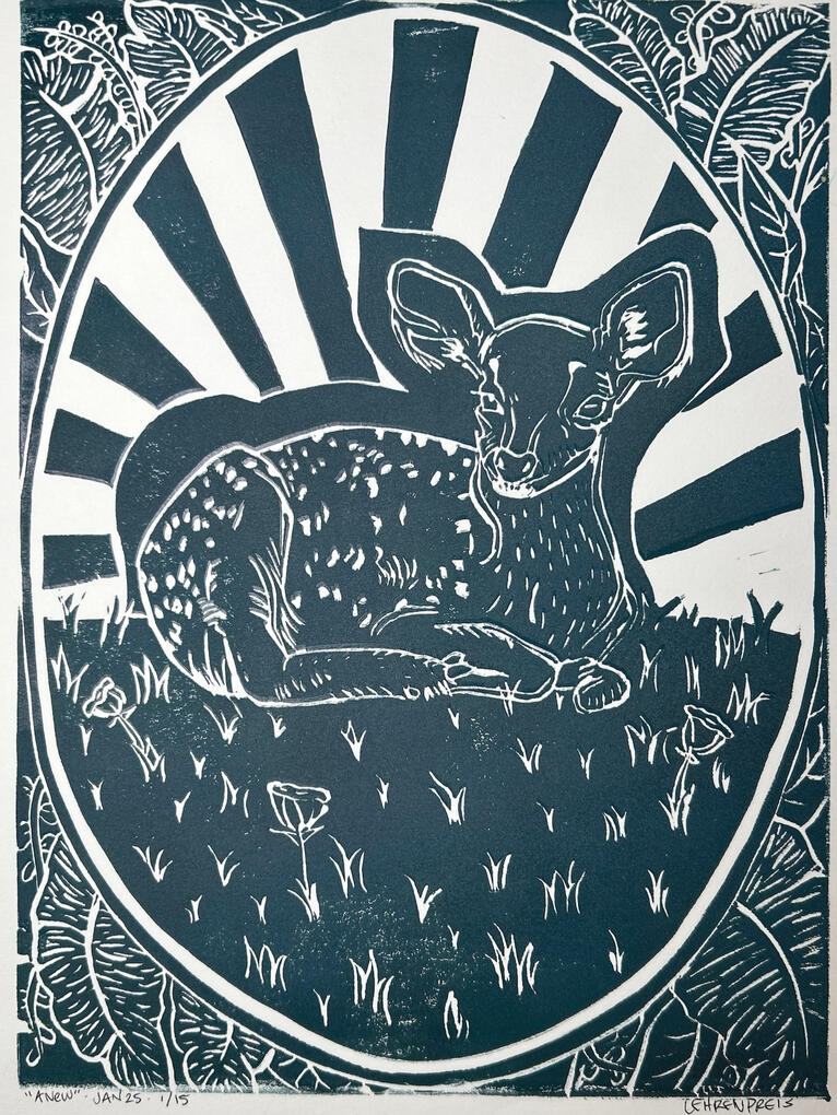 hand-cut linocut print of a fawn baby dear surrounded by grass and framed by an oval over broad leaves